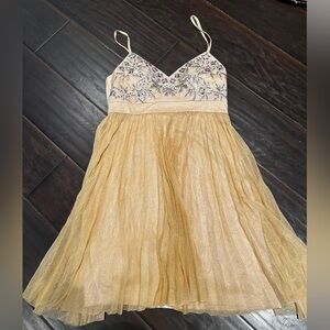 Semi formal dress gold with beading detail at neckline